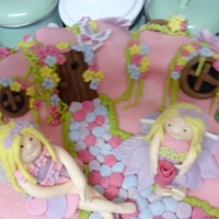 Fairy Land Cake the brief was fairy theme in pink and purple. Cake was chocolate, with chocolate buttercream. The cake was cov ered in fondant and the...