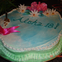 Chelsie's 18Th Bd pineapple cake with tropical flowers and tree. beach and chair