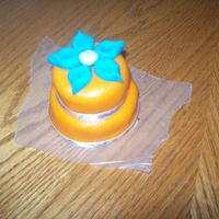 103_1859.jpg flower is made of mmf....the rest of the cake is also mmf except for the ribbon...this cake was made for a garden themed wedding