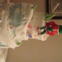 Whismical Crinch Is a whismical cake Grinch with buttercream and the cake's top fondant and the Grinch was made with crips cereal