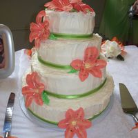 White Wedding Cake Layered cream cheese frosting with gumpaste orange tiger lilies.