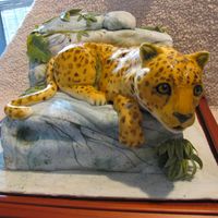 Knightville Elementry School Jaguar This was made for a school auction to raise funds for books. It is fondant covered pound cake painted to look like rocks with vines. The...
