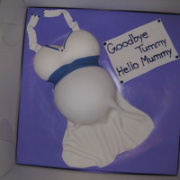 Baby Shower Cake My first attempt at a pregnant lady cake. Vanilla cake covered in fondant accents.