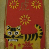 Chinese New Year Cake that I made for year of the Tiger. Red velvet cake, with vanilla buttercream and homemade strawberry sauce filling.