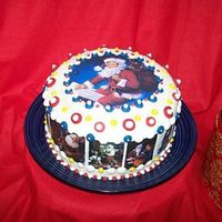 Santa Claus Fondant and edible images. Buttons are royal icing.