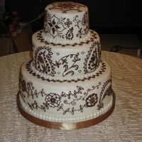 Mehndi Wedding Cake Traditional white cake with mango curd filling and mango infused buttercream icing. The decoration on the cake was inspired by Mehndi (...