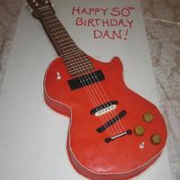 Electric Guitar Devil's Food Cake covered in buttercream with fondant accents.