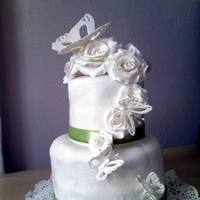 White Roses And Lace Butterflies 4'" and 6" with satin ribbon and gumpaste roses and butterflies. Fondant covering wasn't the greatest but I'm...