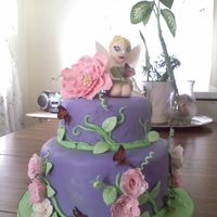 Tinkerbell Cake My first attempt on a two tiered cake. Cake is for my daughter birthday. This one is a first time for everything. All flowers and...