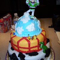 Buzz Lightyear Buzz Light year birthday cake for my grandson....Bottom layer is marshmellow fondant with Buttercream cow spots, other two layers are...