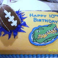 Football Themed Birthday Party - Florida Gators This cake was done for a boys birthday. He was having a Florida Gator themed party. Yellow cake with fondant, Football is a carved...