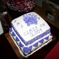 Granddaughter Granduation Cake This is a made from scratch pound cake cover in marshmallow fondant bottom layer. Top layer is a chocolate fudge cake covered in...