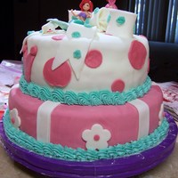 Princess Ariel this is a princess ariel cake done for a little girls birthday. Strawberry Fondant covering a yellow cake. All edilble except figurine on...