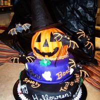 Halloween Birthday Cake Fondant covered hand carved yellow cake. Hat is carved crispy treats covered in fondant