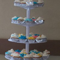 Cupcake Tree Vanilla cupcakes with filling and decorated with buttercream begonias, carnations and swirls. I made 100 for my parents 60th wedding...