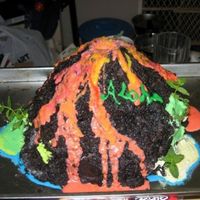 Volcano Cake This is a cake I made for my Sister-in-Law's co-ed Luau Baby Shower. The core is a bundt cake with partly cooked brownie shaped on top...