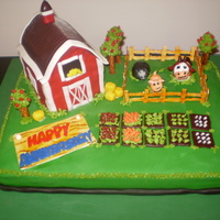 Farmville Anniversary Cake This is a Farmville cake requested for an anniversary. It's devil's food covered in fondant with fondant animals