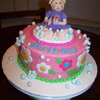 Emme's Bubble Cake 8" iced in BC with fondant accents and gumpaste girl. My friend asked me to incorperate her plates and napkins with a bubble theme.