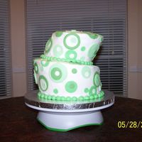 Green Topsy Turvy Graduation cake. This was my first attempt at carving a topsy turvy. I was so intimidated by the idea of cutting it, but I'm glad I...