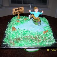 Cakes_035.jpg My friend wanted a German Chocolate cake with coconut for her husband and she wanted it to incorperate fishing. So its a fondant pond,...
