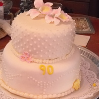 90Th Birthday Stacked Fondant Cake This was for my Grandma's 90th birthday. It is WASC cake w/ Raspberry Lemon Buttercream Filling and White Almond Buttercream filling....