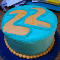 Orange And Teal Fondant Bead Birthday Cake This was for my brothers 22nd birthday. I wanted to use bright orange because thats his favorite color, so its a little funky in a neat way...