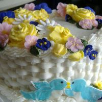 Wilton Course 2 Finale Cake Coconut Cake w coconut B/C Filling.My birds decided to start to fall apart (moisture from b/c?). This was a fun learning experience overall...