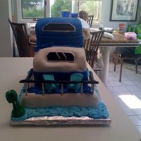 House Boat Make for a surprise 50th and designed after the birthday boys house boat. The main accessory for this family were the teal aderondak chairs...