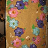 Lei My very first cake!This was for a going away party for a friend who was moving to Hawaii. Each flower is an individual cake. Everything but...