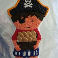 Pirate Boy I made this cake for my grandson's pirate themed 4th birthday party. The frosting is buttercream. The gold pieces are actually little...