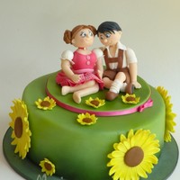 Couple With Sunflowers For a girl who likes traditional costumes- that's an Austrian "Trachtenpaerchen" with "Dirndl und Lederhose"