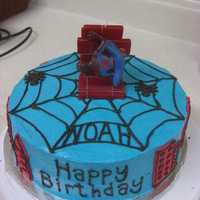 Spiderman For a spiderman birthday. The mom found a pic online that she liked and I recreated it. The top is a candle and the buildings on the side...