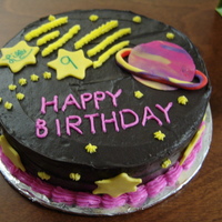 Space Cake I made this for a little girl who loves space. She wanted Saturn and a shooting star on the cake. The planets and stars are fondant.