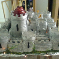 Castle Cake When I made this cake it was a good challenge it took six madeira cakes and was really heavy. I put black toffee chews on the roof and...