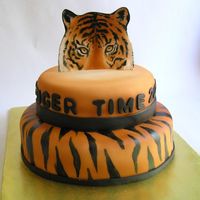 Tiger Time This was done for and end of year thank you for a school principle. Its white fondant with airbrushed color and hand painted tiger stripes...
