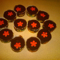 Ganache Cupcakes french vanilla cake filled and topped with dark chocolate ganache and a fondant flower