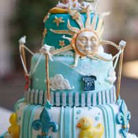 Welcome To The World Baby Boy Shower Cake The Sun shines with a white picket fence, clothesline for a boy with hand painted sports team and trendy logos. The moon and the stars...