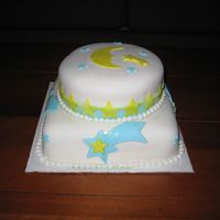 My Second Fondant Cake Just for fun, moons and stars. Vanilla rum cake, white fondant, teal and yellow fondant.