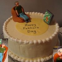 Father's Day Cake This was made for my dad w/his new fathers day present. I wish we could upload pics of people, cause this little fellow looks just like him...