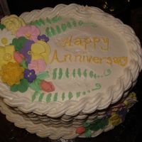 Parents Anniversary My mom loved the cake I did for Course 2 (only saw a pic) that I made them one for their anniversary. Royal flowers and whipped cream...
