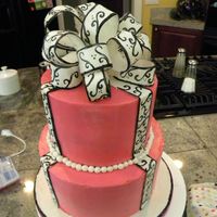 Pink Scroll Bow Cake THis cake was hard! It didn't turn out just like I wanted but I like it anyways. The cake is pink buttercream and the bow is fondant (...