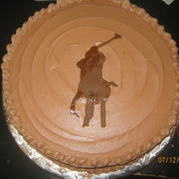 Polo Logo Cake This is a Chocolate cake with chocolate morsels covered in Chocolate buttercream (made from scratch), with the Polo Logo made from fondant...