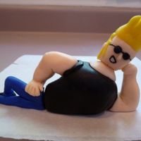 Johnny Bravo Made this cartoon character to be put on the top of a heart cake (to be made later) for my sister-in-laws birthday cake. She is a BIG...