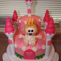 Pink Castle Cake Tried doing a Wilton style baby castle cake for my daughter's 2nd Birthday. Had to make a few adjustments but turned out not too bad....