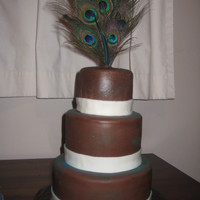 Peacock Cake All she said was.. peacock feathers (not the peacock animal itself).. brown, and ivory. This is what she got. :)