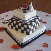 Race Car Theme Wedding Cake. She wanted the checkered flag effect on the middle tier. Chocolate cake/bavarian filling.
