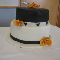 Black/burnt Orange Calla Cake Wedding colors, wedding flower is the orange calla lilies (which are gumpaste)