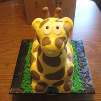 Giraffe! Yellow cake carved, covered in buttercream fondant, fondant spots, gumpaste little nubbies on his head. The head is fondant covered...