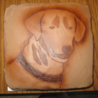 Sampson! This is chocolate ganache.. outline of dog head painted with airbrush, inside detail done by hand with paintbrush.
