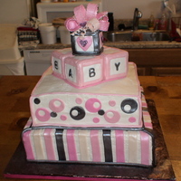 Baby Block Cake 12 inch on 14 inch square cakes. Blocks are made from Rice Krispie treats and fondant details. Airbrushed pearl with disco dust on the...